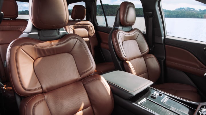 The front row's Perfect Position Seats in a 2024 Lincoln Aviator® Reserve model with Ebony Roast interior | Parkway Lincoln in Dover OH
