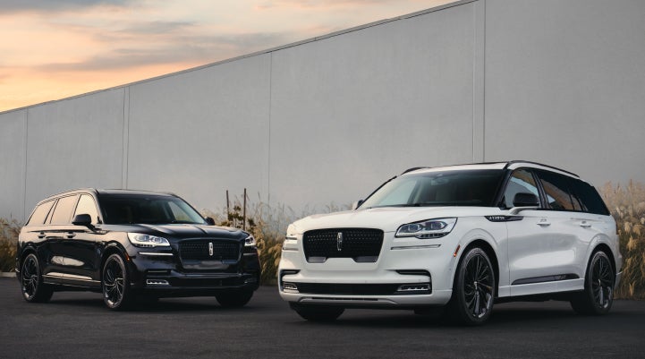 Two Lincoln Aviator® SUVs are shown with the available Jet Appearance Package | Parkway Lincoln in Dover OH