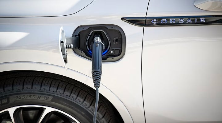 An electric charger is shown plugged into the charging port of a Lincoln Corsair® Grand Touring
model. | Parkway Lincoln in Dover OH